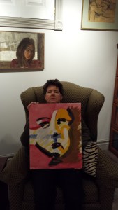 Me holding My Self-portrait with above portrait of My Mother Elizabeth Walden Hyde by Bernard Taylor 1966